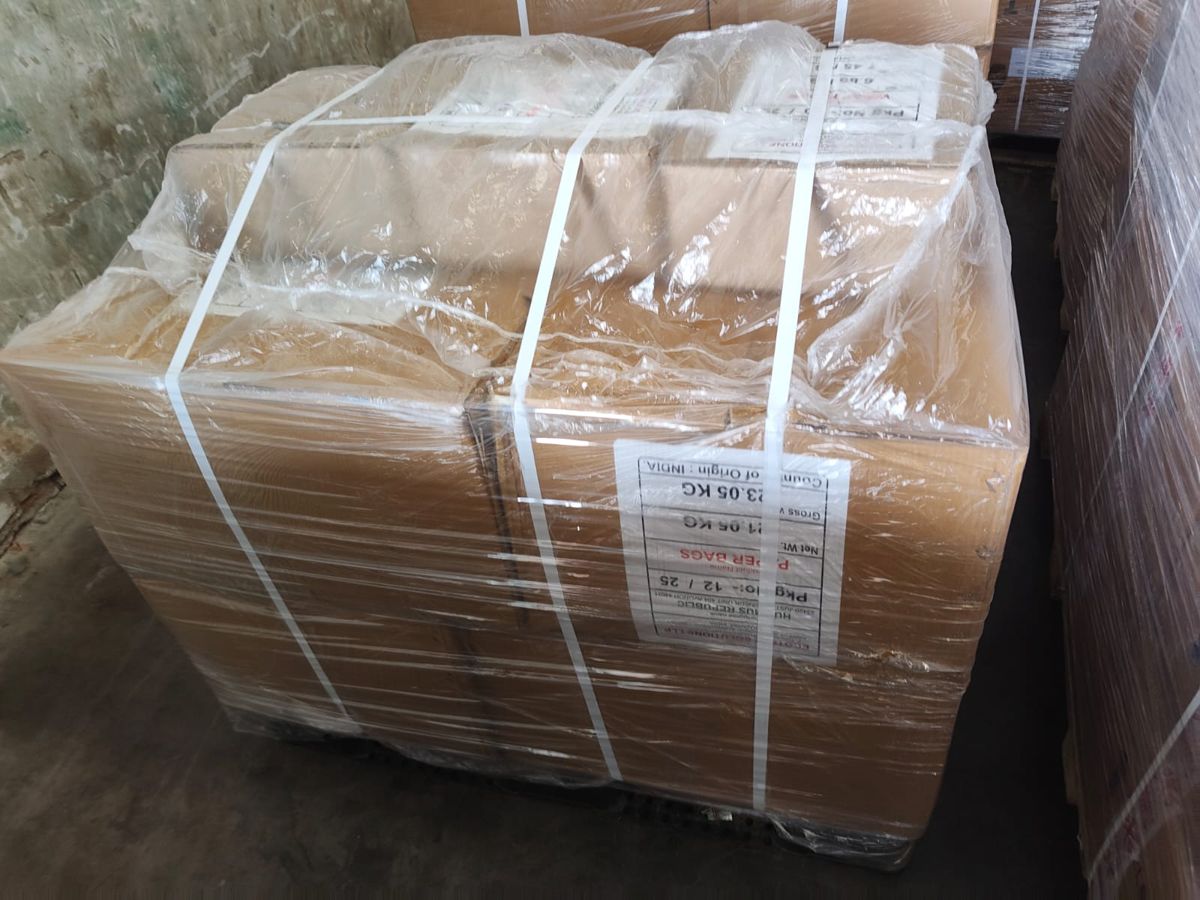 Strapped pallet with shipping label: paper bags, package 12 of 25