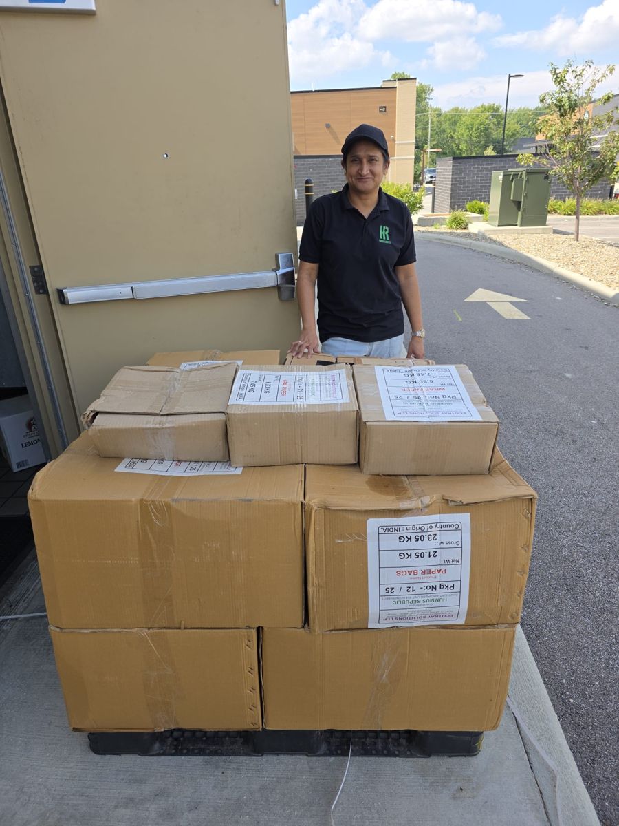 Hummus Republic team member with the delivered cartons in Avon, Ohio