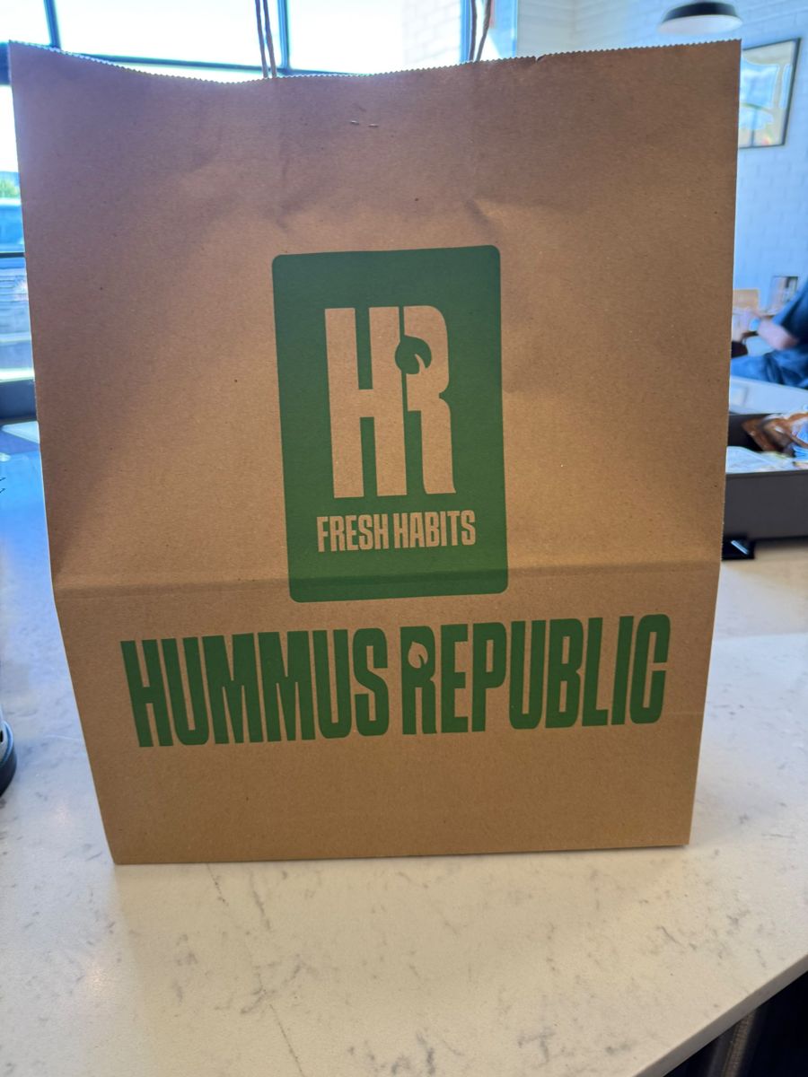 Printed kraft bag with twisted handles on the restaurant counter